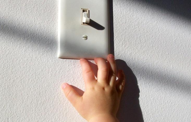 Child-reaching-for-light-switch